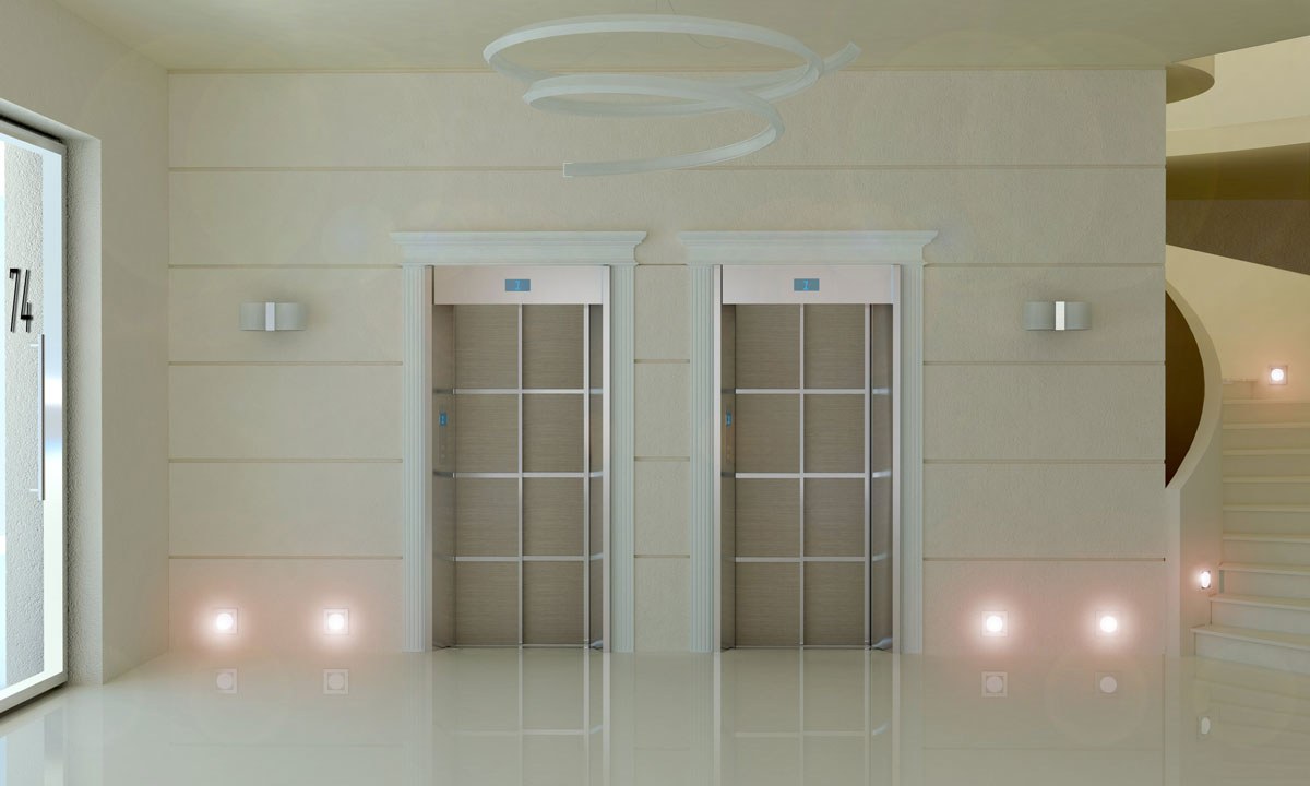 Porte di piano di due ascensori in un ingresso condominiale a Parma